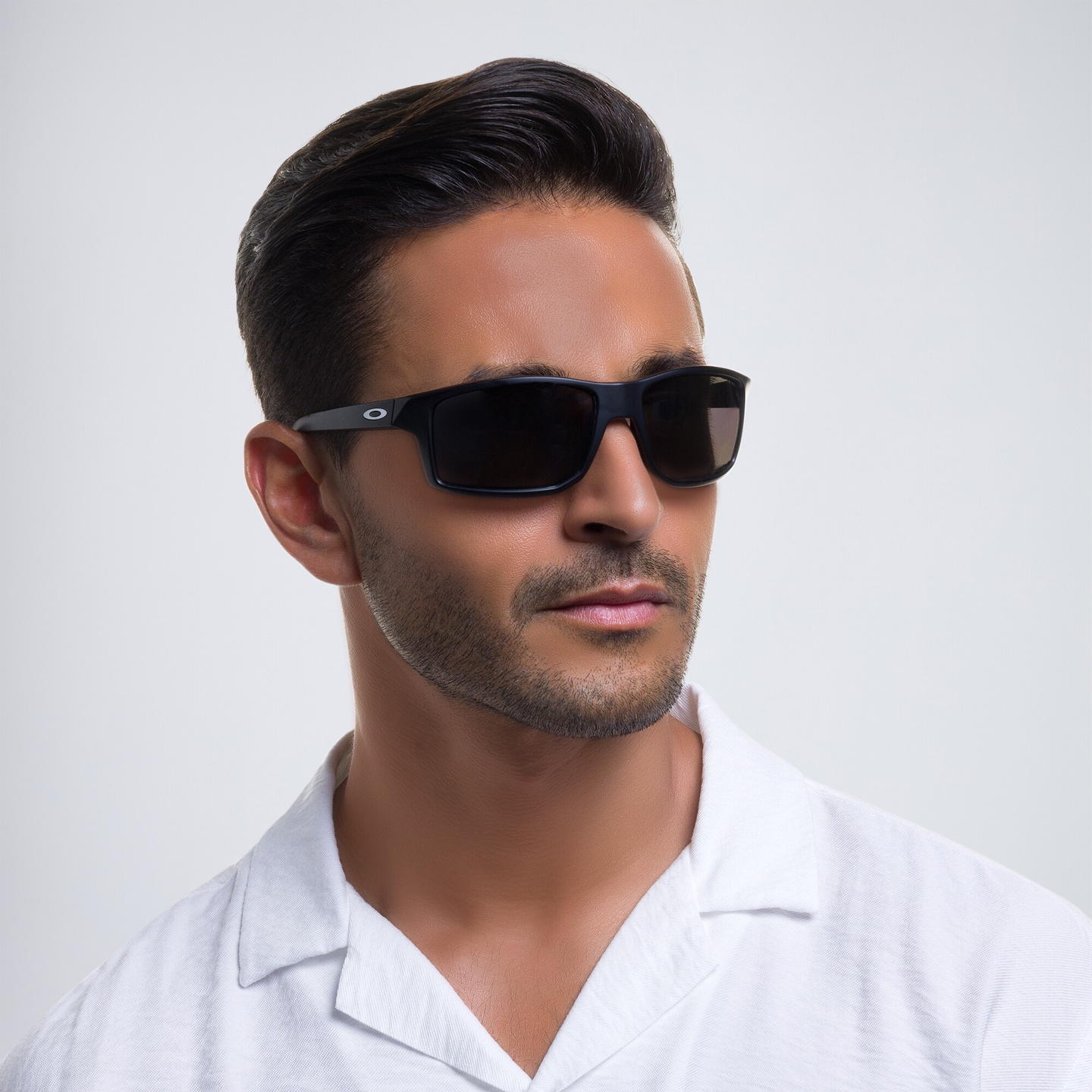 Shop Oakley Gibston Rectangle Sunglasses in Matte Black online.