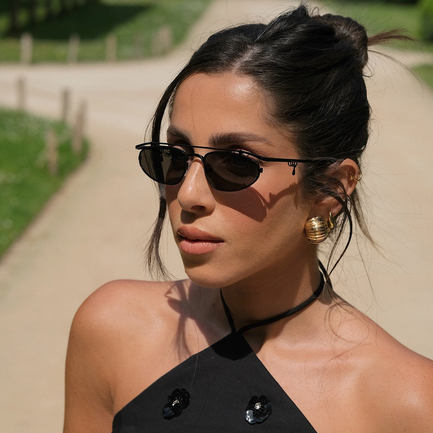 Shop TRICE Nori Irregular Sunglasses in Black online.
