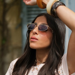 Shop TRICE Nori Irregular Sunglasses in Gold online.