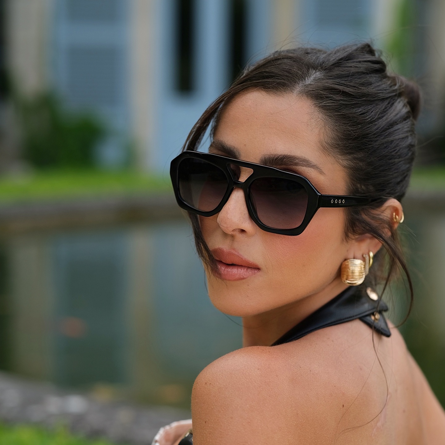Shop TRICE Malaka Irregular Sunglasses in Black online.